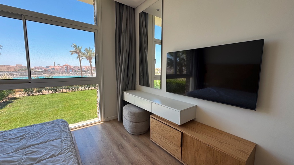 Covered terrace overlooking the garden at Bay Central Somabay apartment