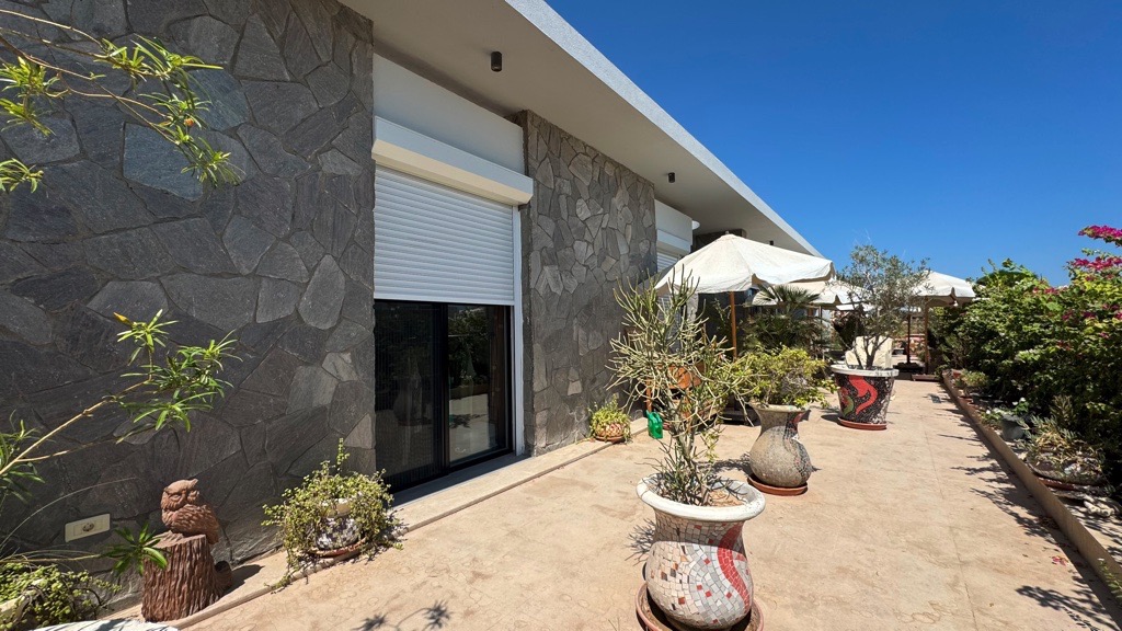 Exterior and landscaped terrace at Wadi Jebal chalet